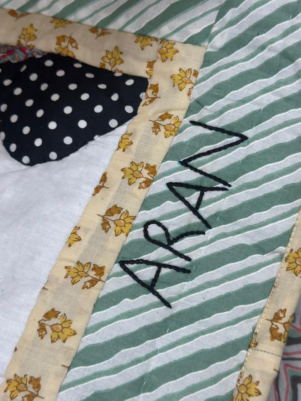 Close-up of an embroidered first name